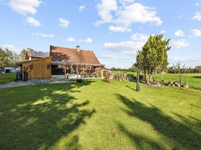 Sale-and-Lease-Back! Ruhe trifft Zukunftschance – Holzhaus auf schönem Grundstück in Pfaffing