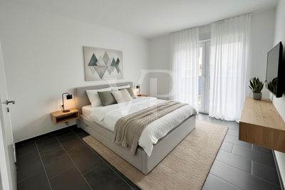 Neuwertige Erdgeschosswohnung mit Terrasse und Tiefgaragenstellplatz