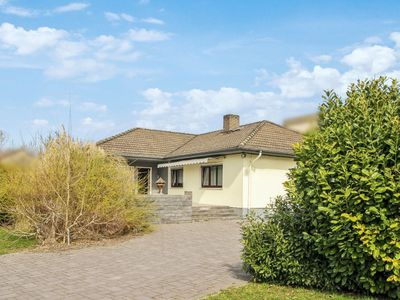 Winkelbungalow mit großem Grundstück in ruhiger Lage von Frankfurt-Preungesheim
