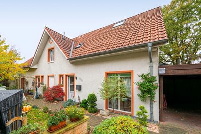 Charmante Doppelhaushälfte mit Gartenidylle, Carport und perfekter Familienlage in Kaltenkirchen
